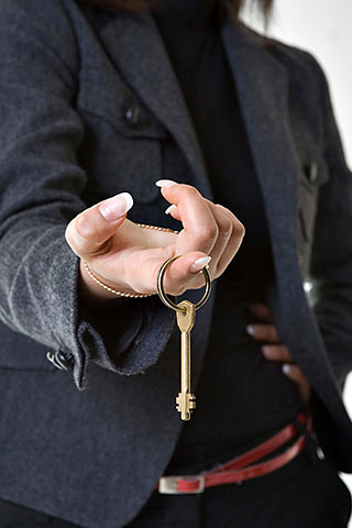 Person holding key